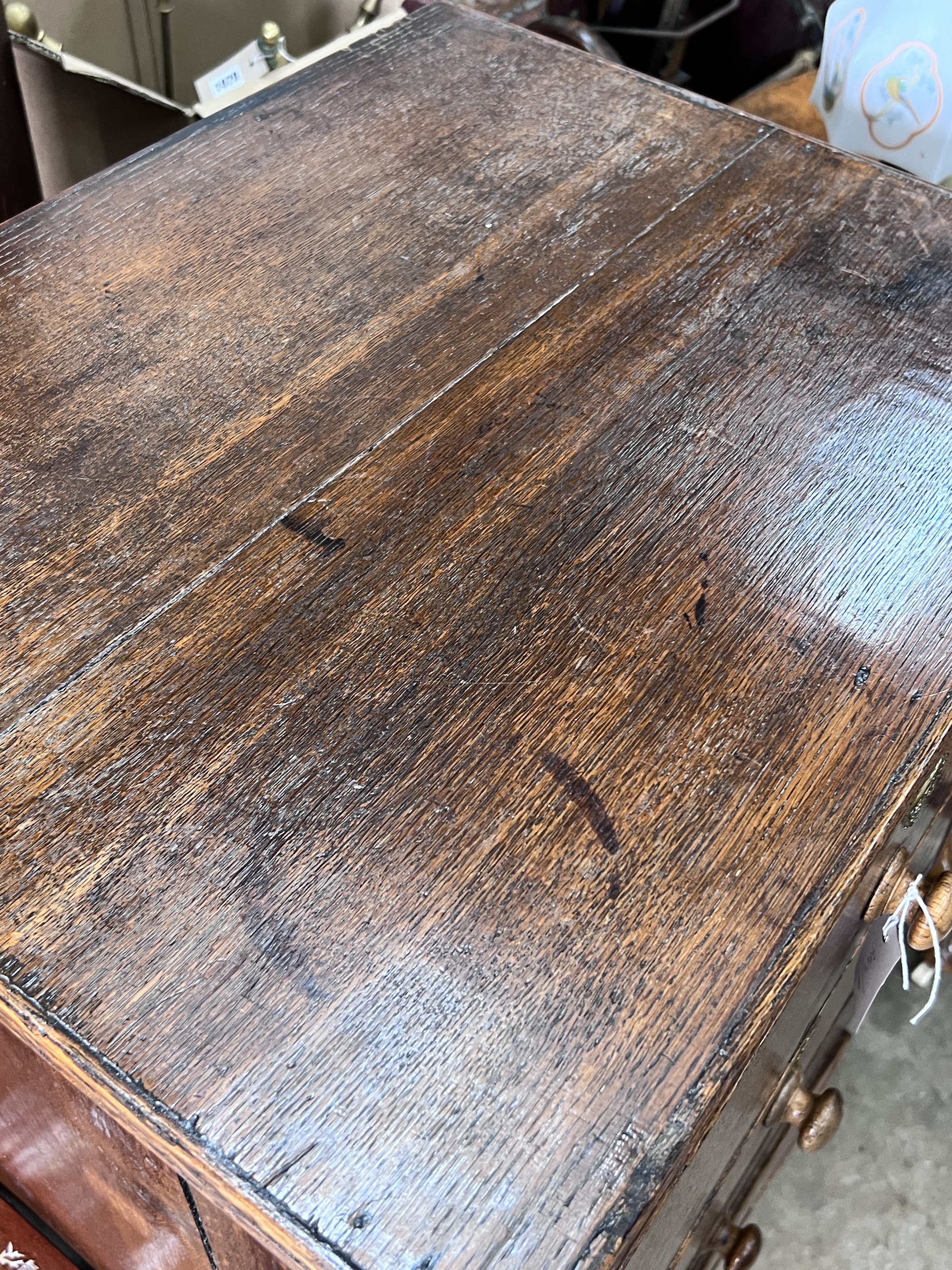 An early 19th century narrow oak four drawer chest, width 59cm, depth 48cm, height 106cm
